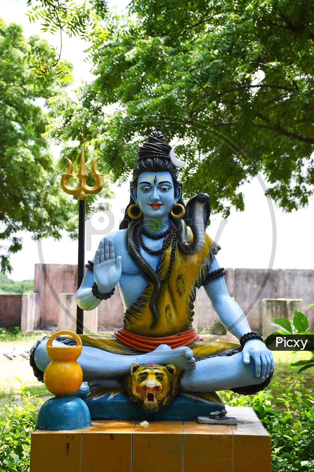 Statue of lord Shiva and Background raining
