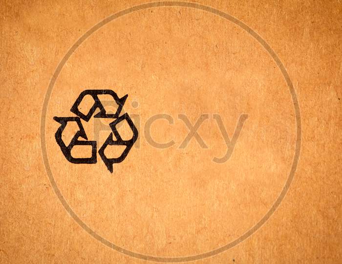 View Of Recycle Symbol Printed In Cardboard. Symbol Used In Items Which Are Recyclable