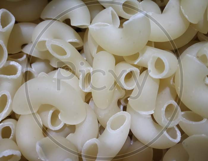 Close up view of curve pipe shaped macroni