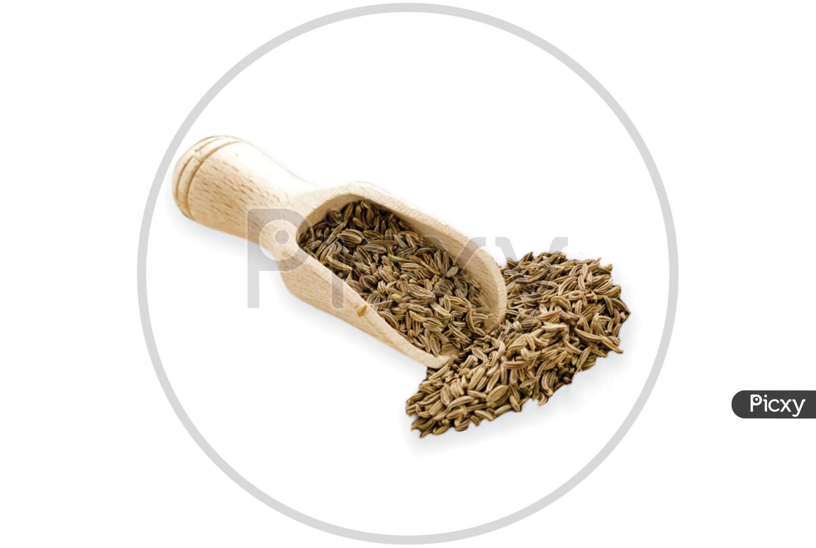 Food Ingredients Heap Of Cumin In A Wooden Scoop, On White Background