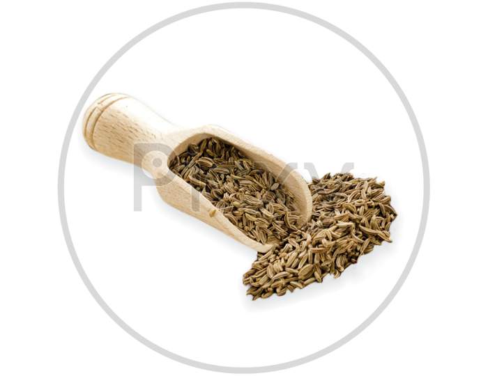 Food Ingredients Heap Of Cumin In A Wooden Scoop, On White Background