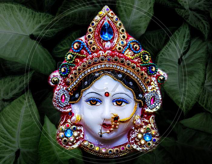 Goddess Durga Face in Happy Durga Puja Subh Navratri Black background. Black and white image Money Making Hindu God.