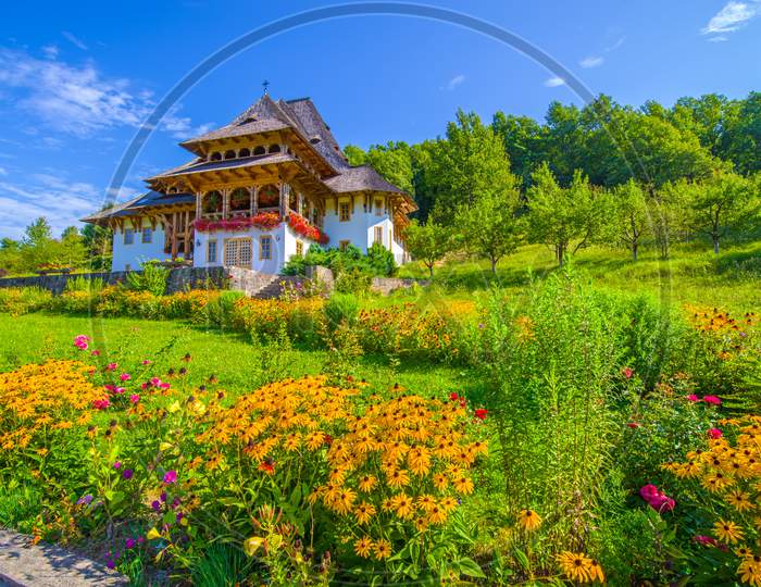 Beautiful Flower Garden At Barsana Monastery In Maramures Region