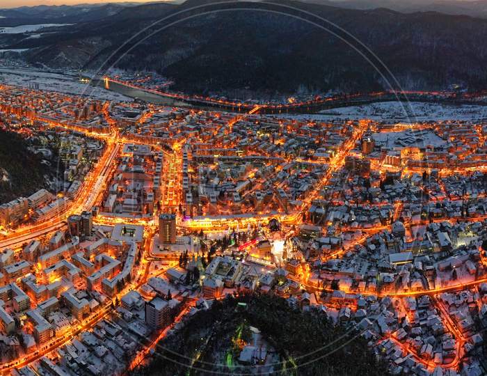 Aerial View Of City Lights In Winter Evening.
