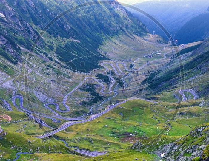 Winding Road In Summer Mountains