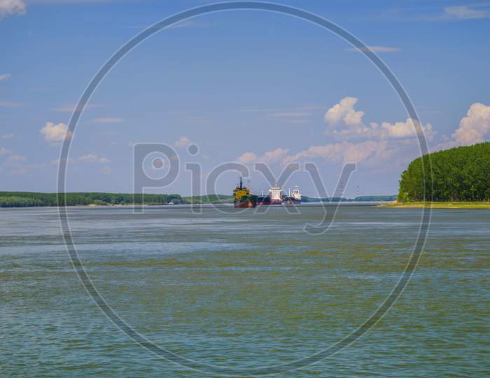 Cargo Ships Downstream On Danube River