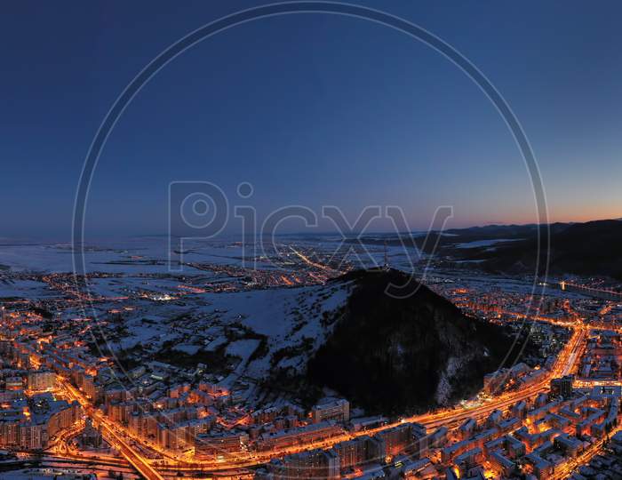 Aerial View After Sunset, City Lights And Mountains