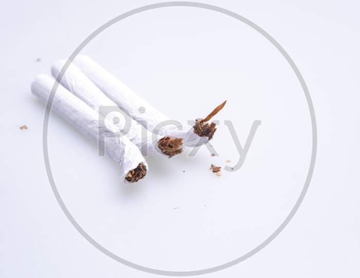 Squeezed Cigarettes On Table