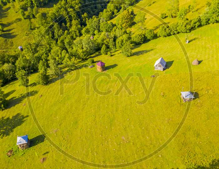Aerial View Of Pasture And Haystacks