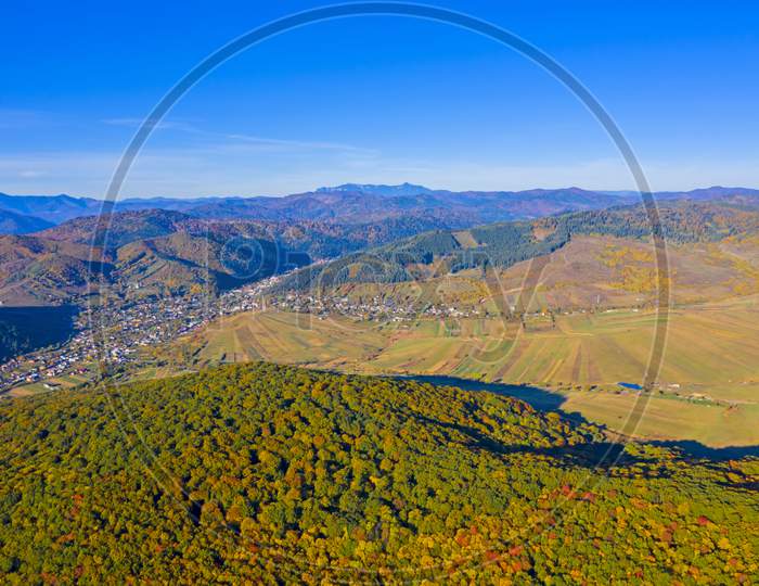 Forest And Village In Aerial Autumn Landscape