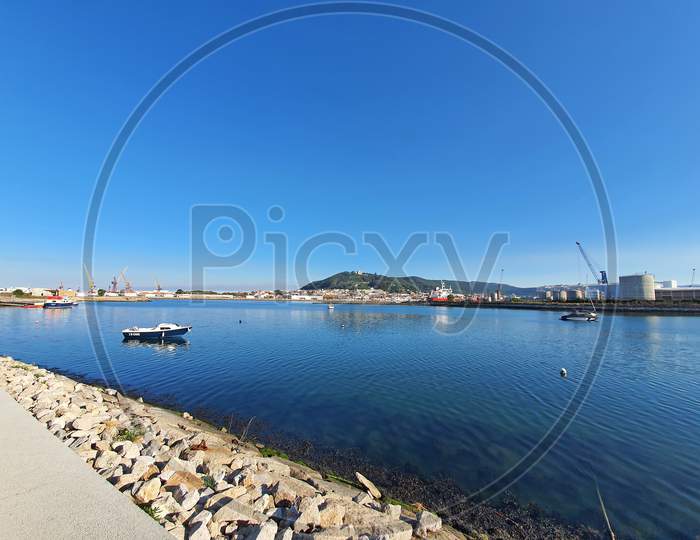 Portugal Coastline Sailing Boat And Industrial Area