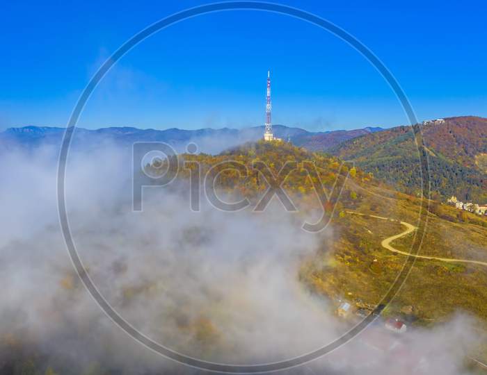 Fog Comming Over Antenna Tower