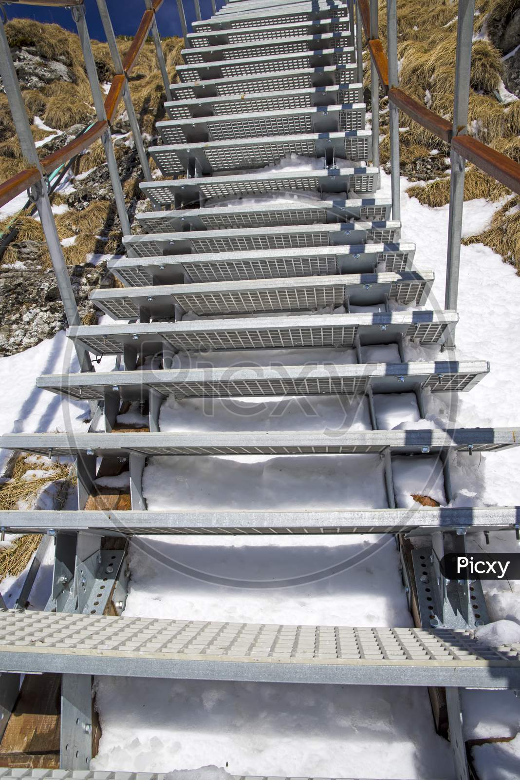 Metal Stairs In Winter Mountain