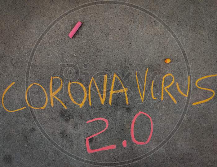 The Inscription Text On The Grey Board, Corona Virus 2.0 Using Color Chalk Pieces.
