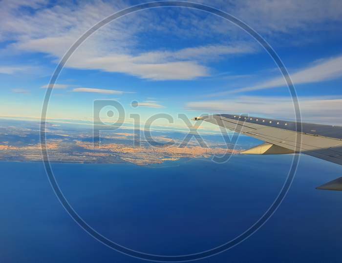 Airplane Wing Over Sea