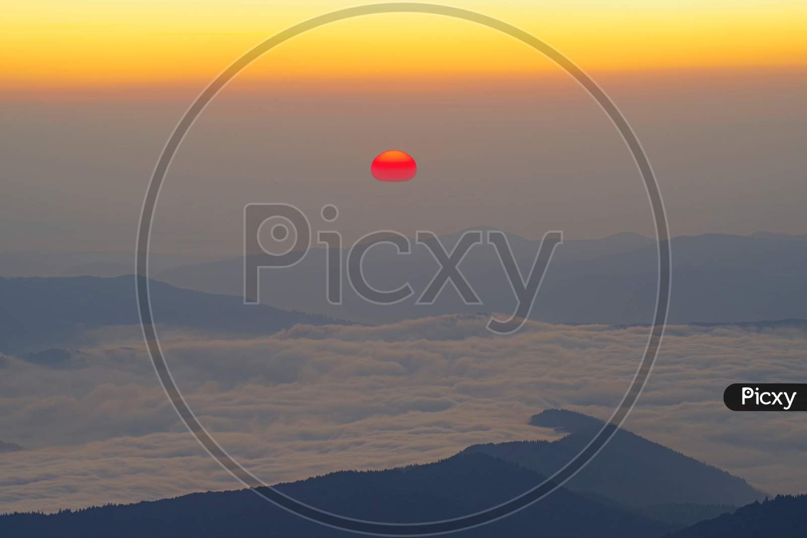 Sunrise Scene With Red Sun Over The Mountains