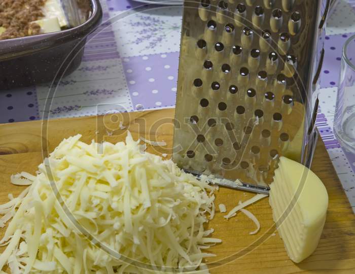 Grated Hard Cheese In The Kitchen