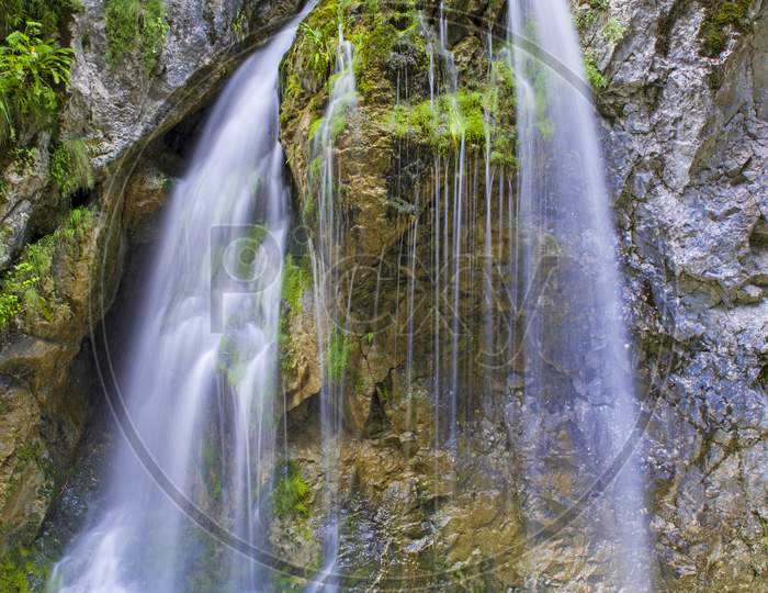 Mountain Waterfall In A Rocky Mountain