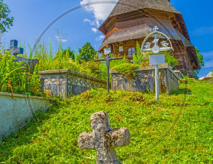 Old Grave Cross And Wooden Maramures Church