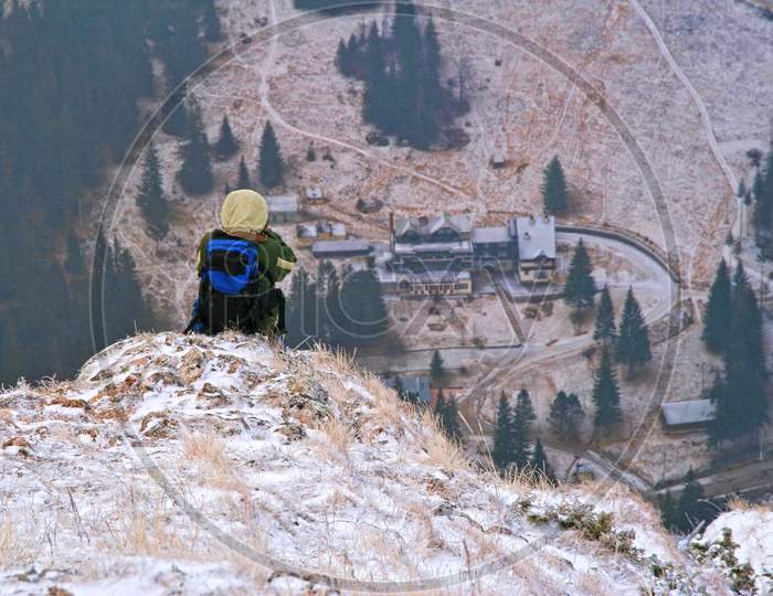 Photographer On Mountain Ridge