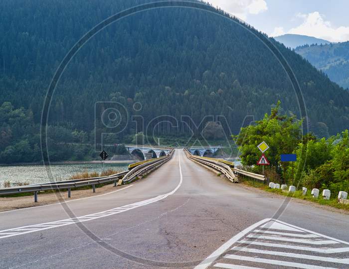 Crossing Bridge Road On Mountain Valley