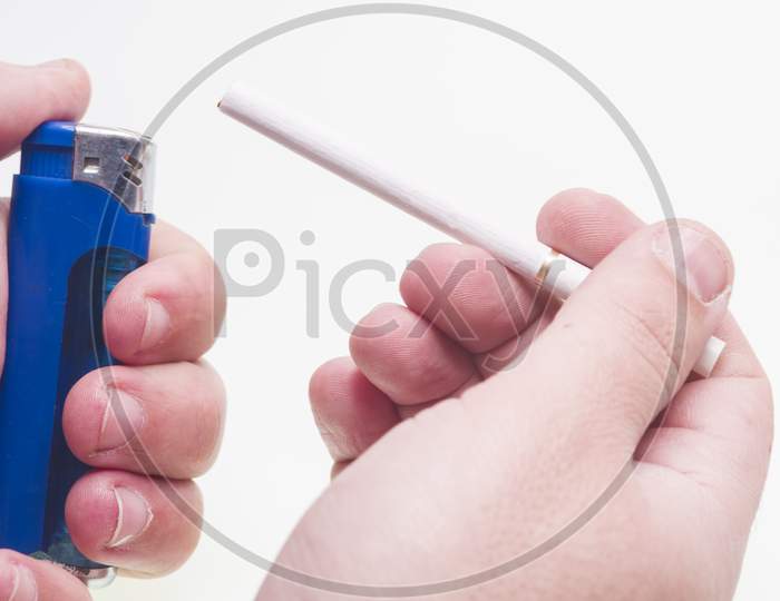 Lighter In Hand With Cigarette