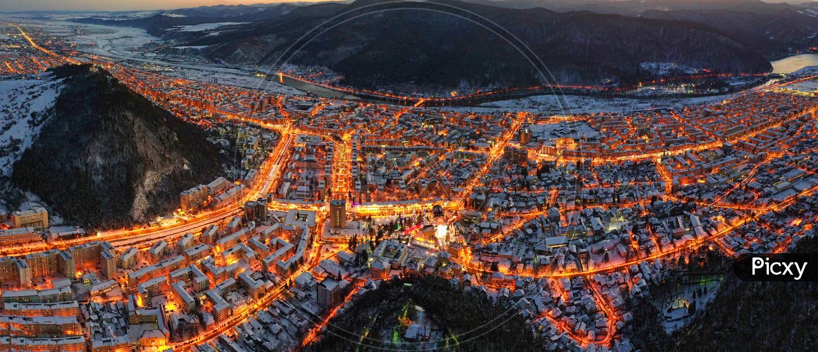 Aerial View Of City Lights In Winter Evening.