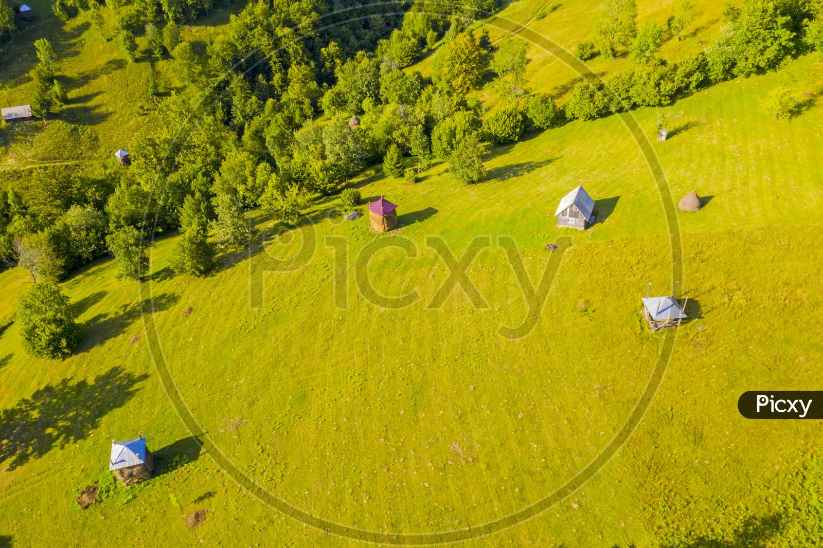 Aerial View Of Pasture And Haystacks