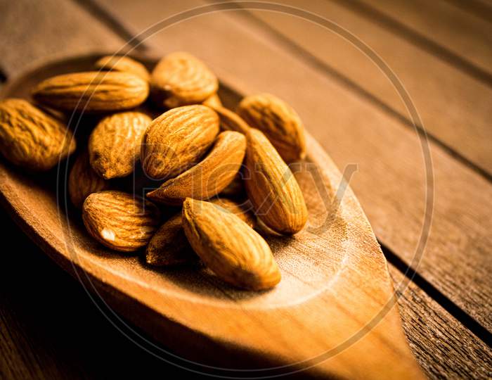 Almonds On A Wooden Table