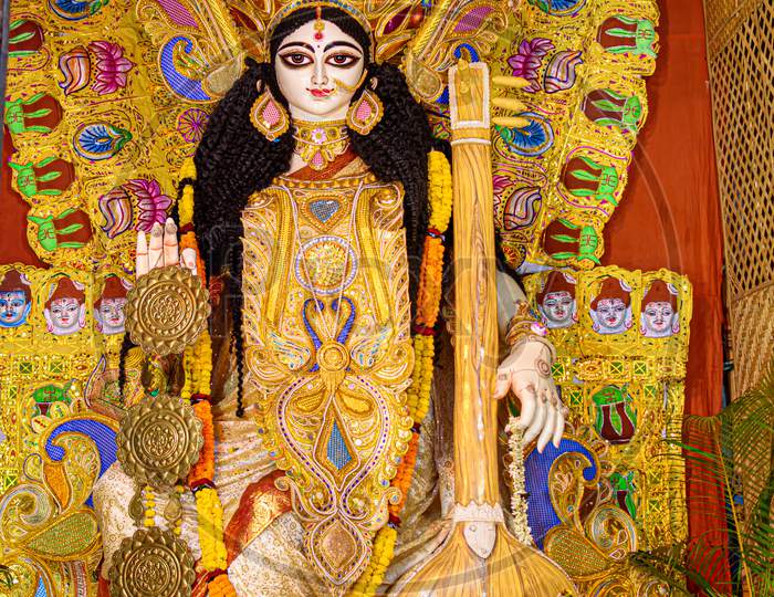 Goddess Saraswati Idol Decorated At Puja Pandal, Saraswati Symbolizes Creative Energy And Is Considered As The Goddess Of Knowledge, Music, Art, Wisdom, And Learning.