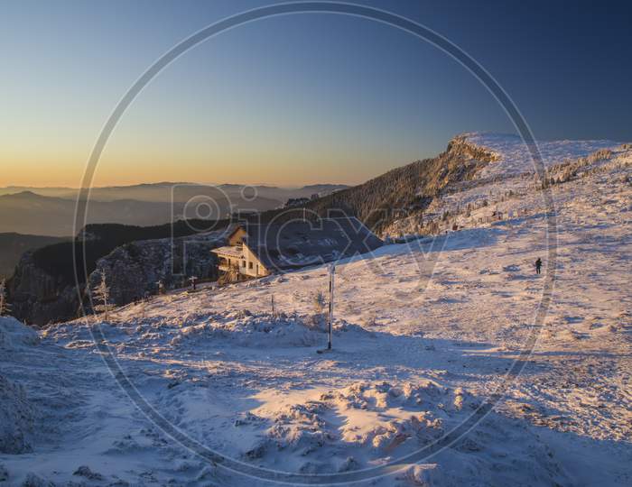 Winter Scene At Mountain Chalet