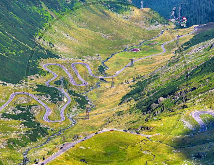 Aerial View Of Curvy Road In Mountains