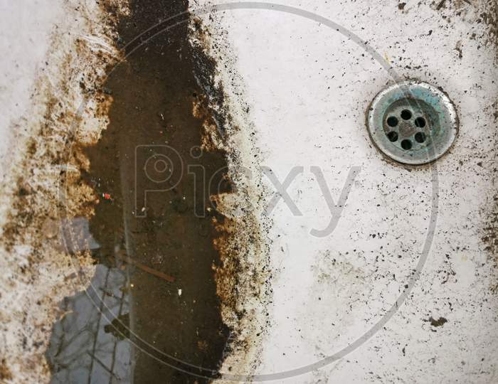 Dirty Wash Basin In Toilet