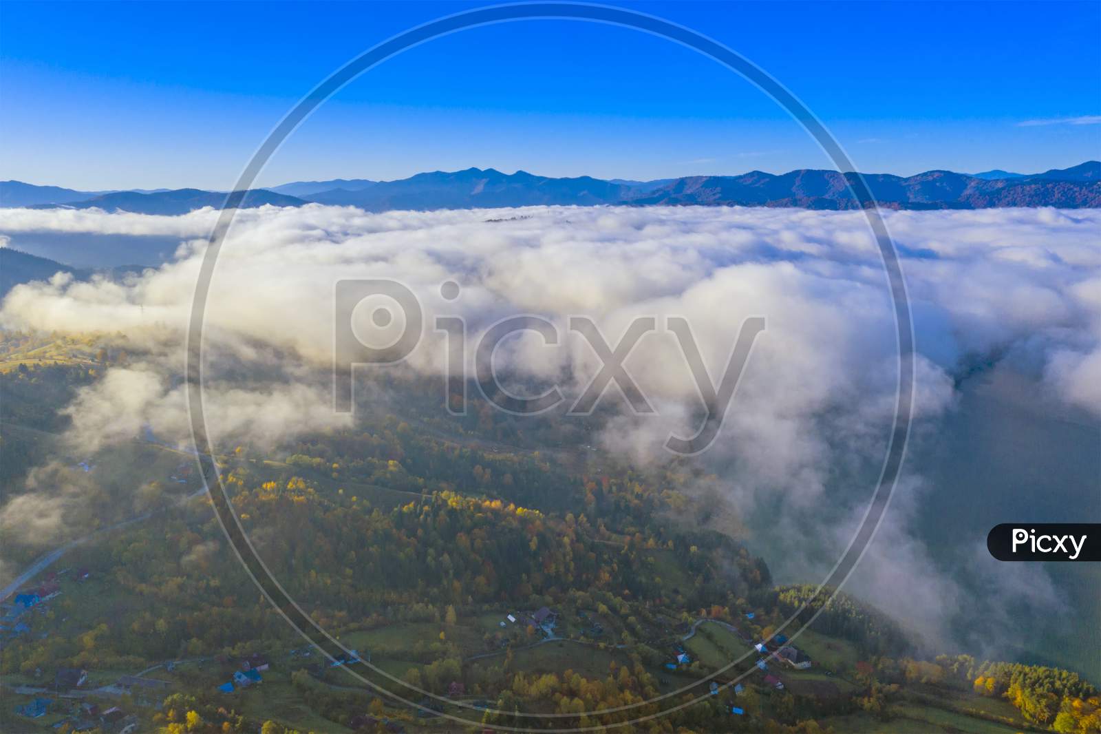 Mist Clouds Over Mountain Valley