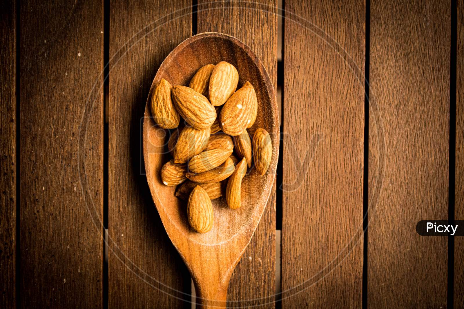 Almonds On A Wooden Table
