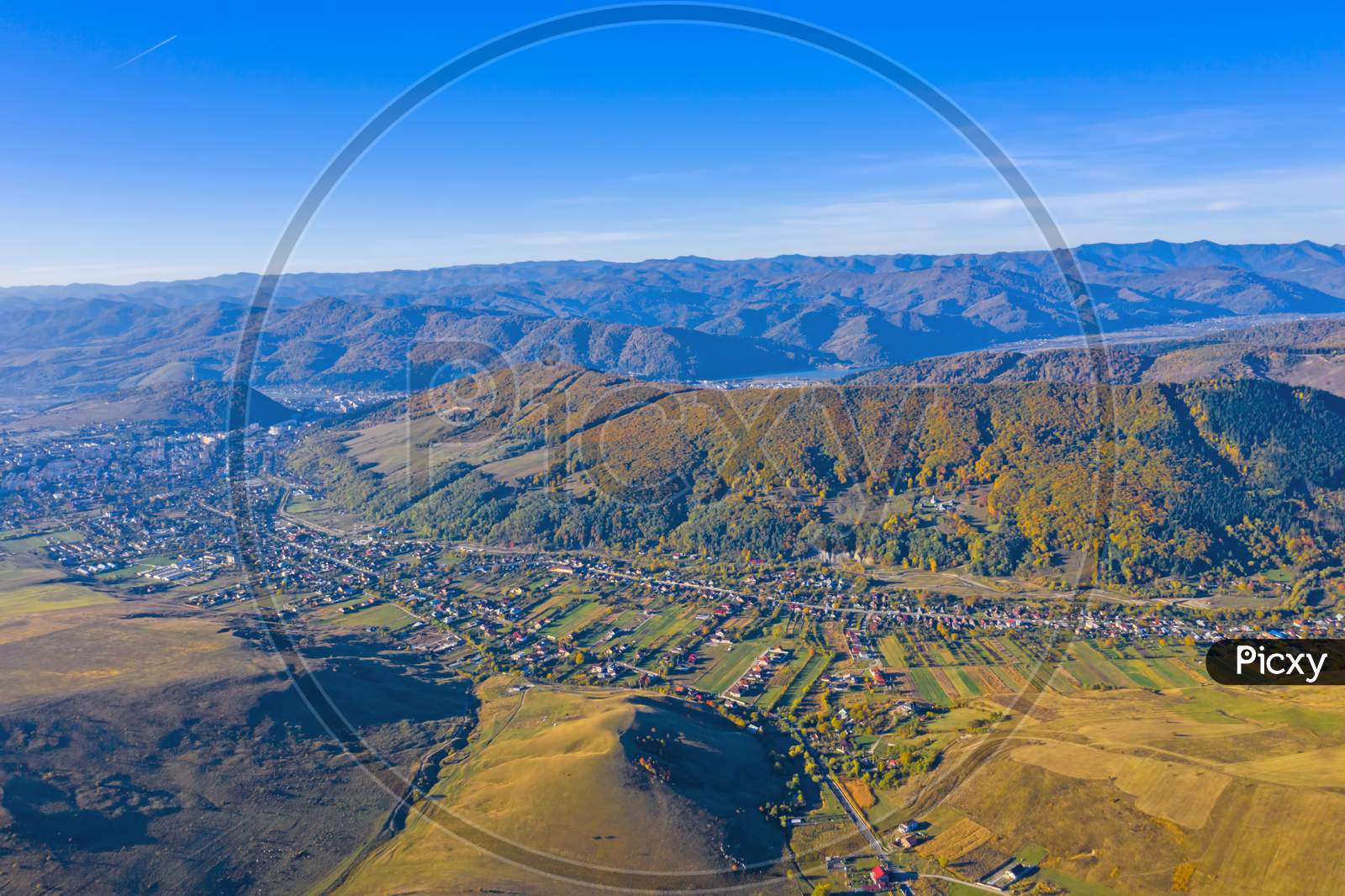 Aerial View Of Village And Autumn Mountain