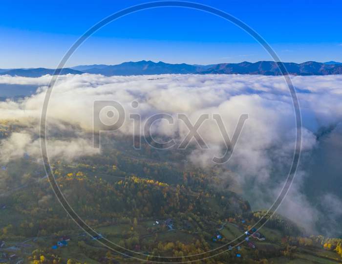 Mist Clouds Over Mountain Valley