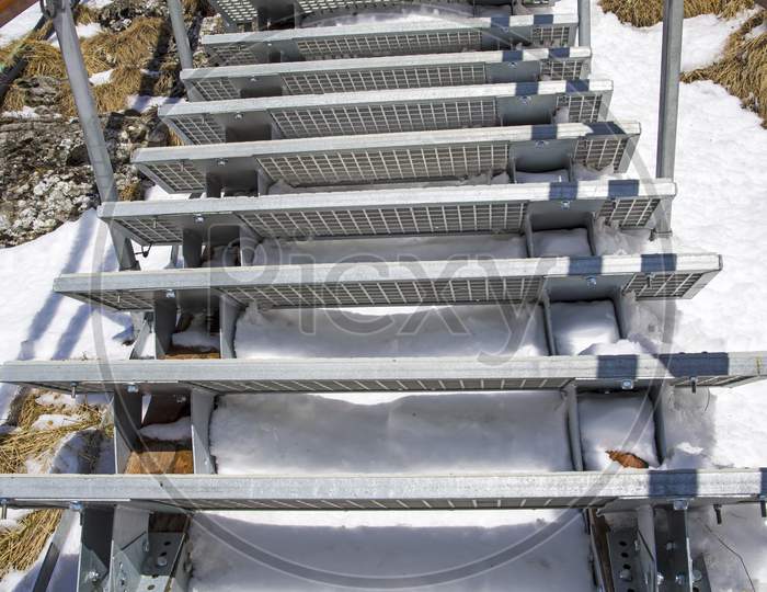 Metal Stairs In Winter Mountain