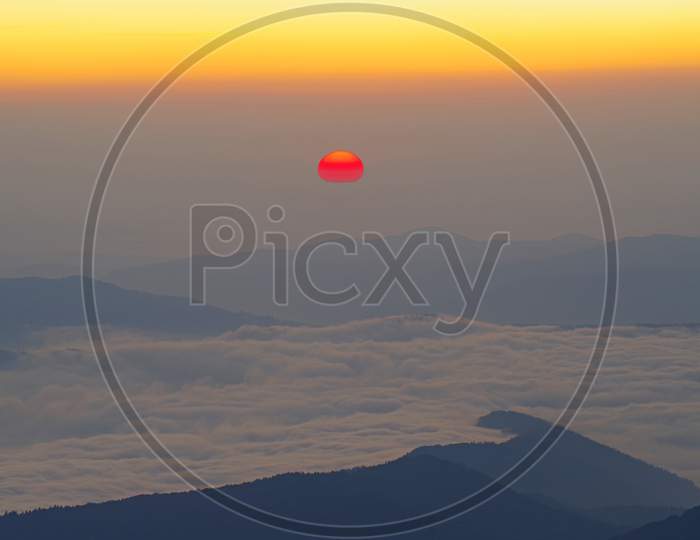 Sunrise Scene With Red Sun Over The Mountains