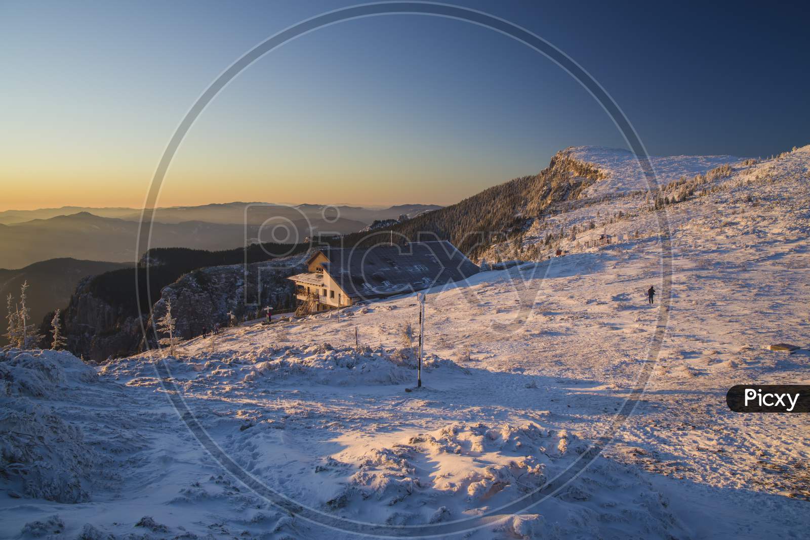 Winter Scene At Mountain Chalet