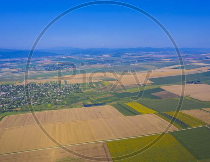Aerial View Of Summer Fields And Village