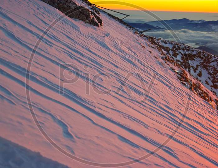 Sun Lights Reflecting On Mountain Snow
