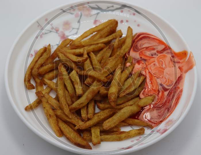 French Fries Stock With Sauce On Plate