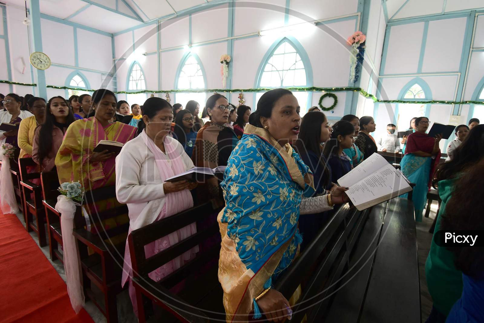 Devotees attends Christmas prayers at  a church in  Assam on Dec 25,2020