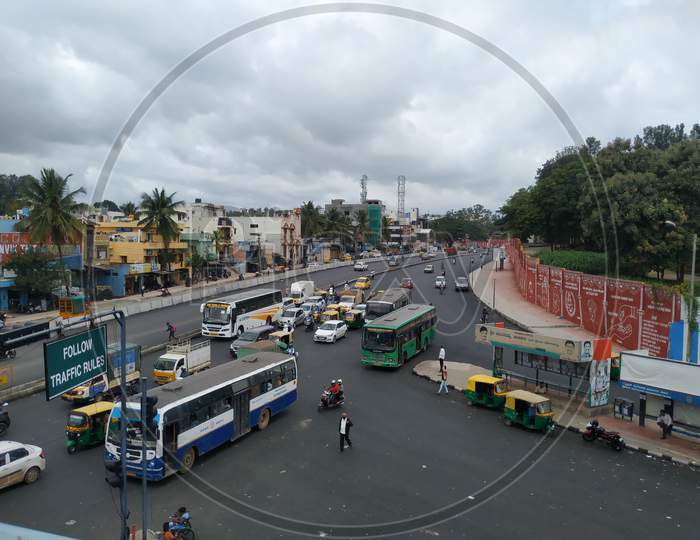 Closeup Of View From Sumanahalli Bridge Of Four Lane And Bmtc Bus Stop With Heavy Traffic At Sumanahalli To Sunkadakatte Road