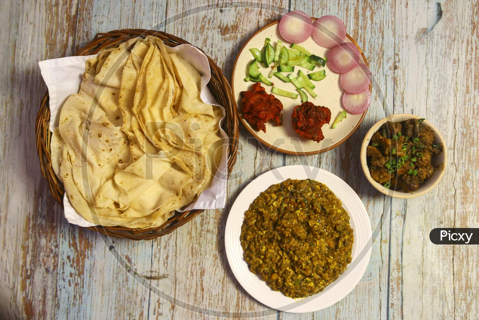Rumali roti, daal tarka, chicken kosha, chicken pakoda and salad