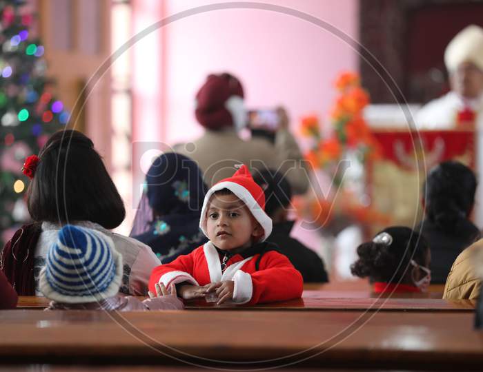 Christian offers Christmas prayers at a church in Jammu, 25 December 2020.