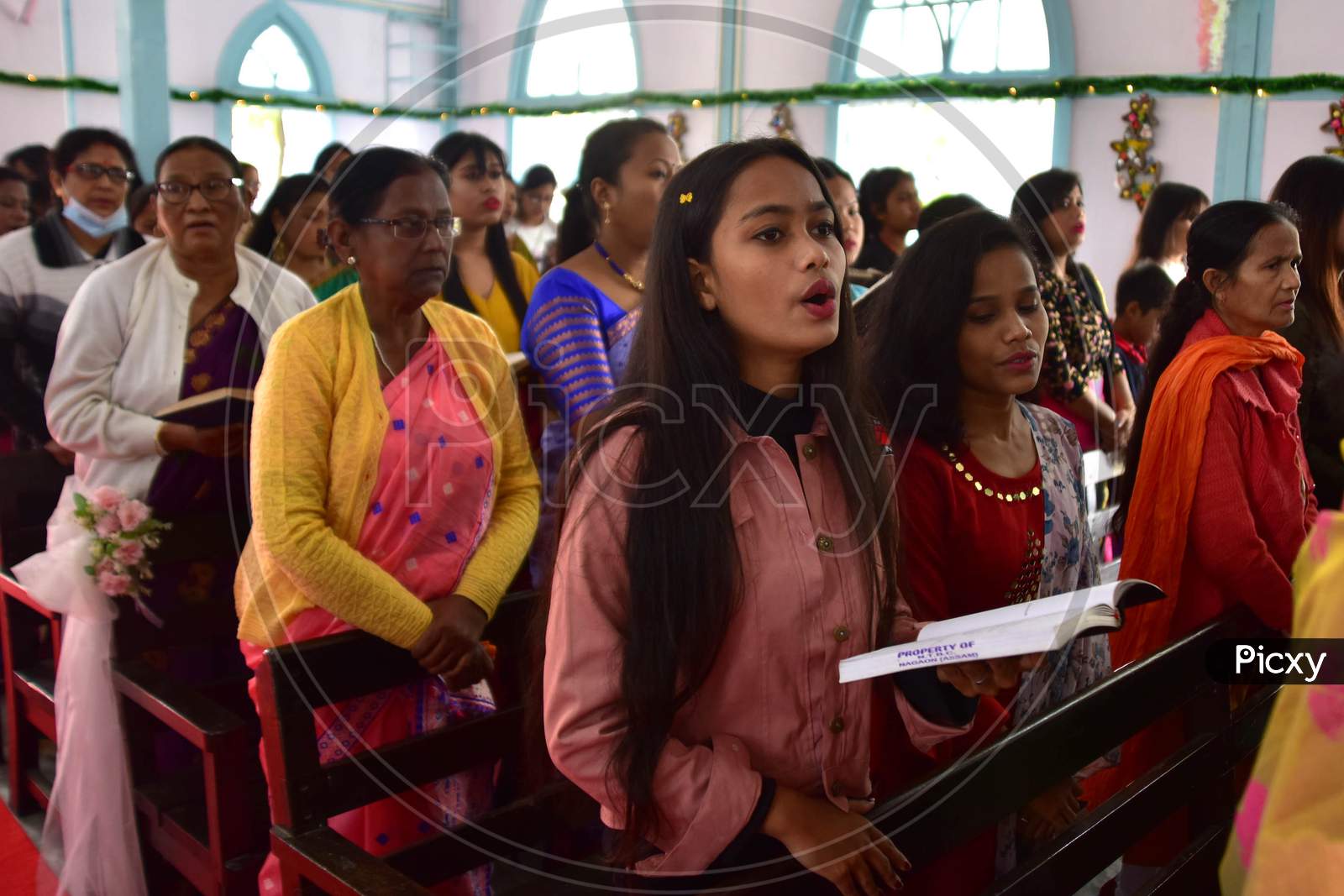 Devotees attends Christmas prayers at  a church in  Assam on Dec 25,2020