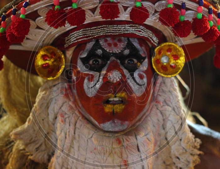 Close up of a theyyam artist
