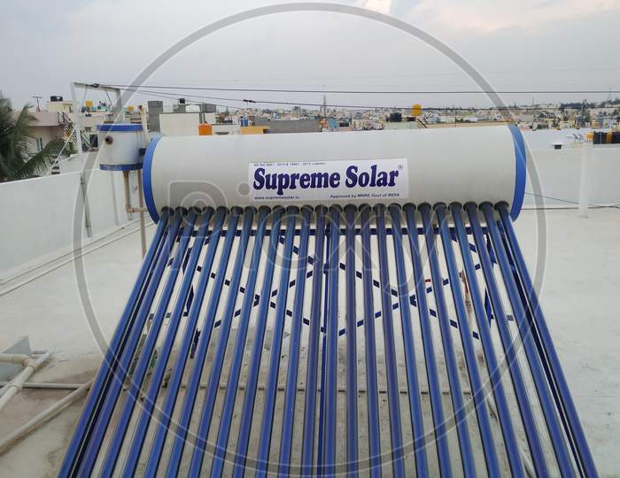 Closeup Of Supreme Solar Water Heaters, Water Storage Drum And Panels Fixed Top Of The Building
